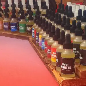 Bottles of beard oils in rows