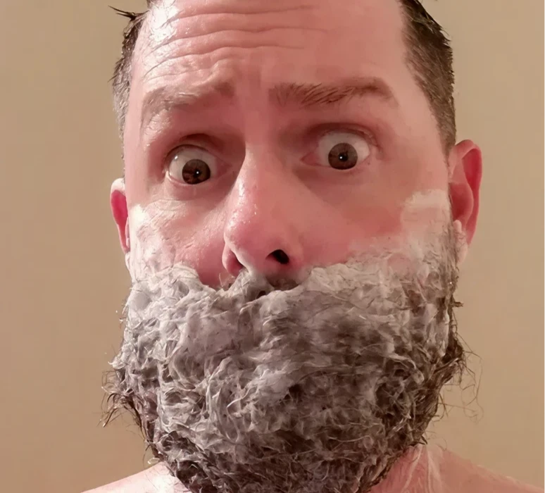 Man with shaving cream on beard